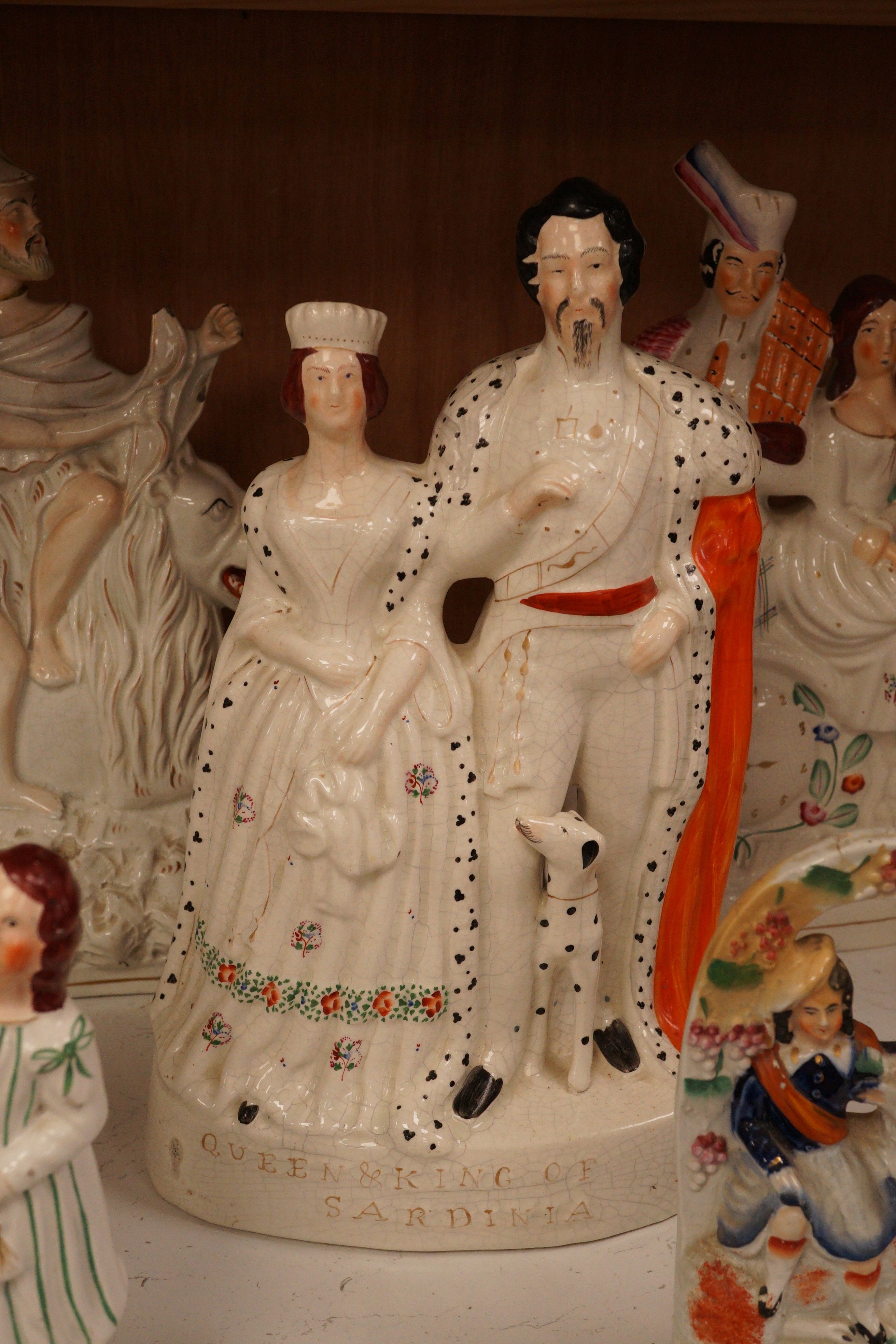A group of Staffordshire pottery groups, tallest 38cm